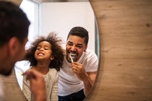 Rochester NY father and daughter brushing teeth