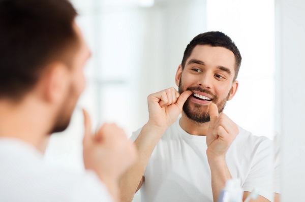 Nighttime flossing routine in Greece NY