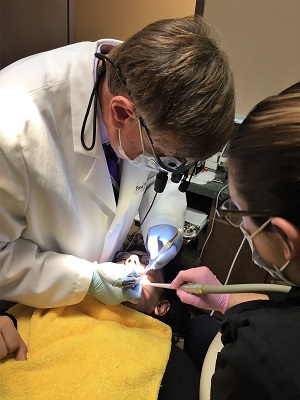 Dr. Sussman performing a dental procedure in Rochester with PIEZOSURGERY technology