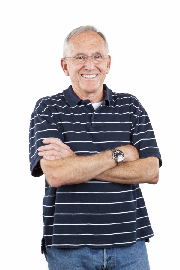 A Fairport man shows off his implant-supported dentures